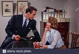 Sean Connery as James Bond and Lois Maxwell as Miss Moneypenny